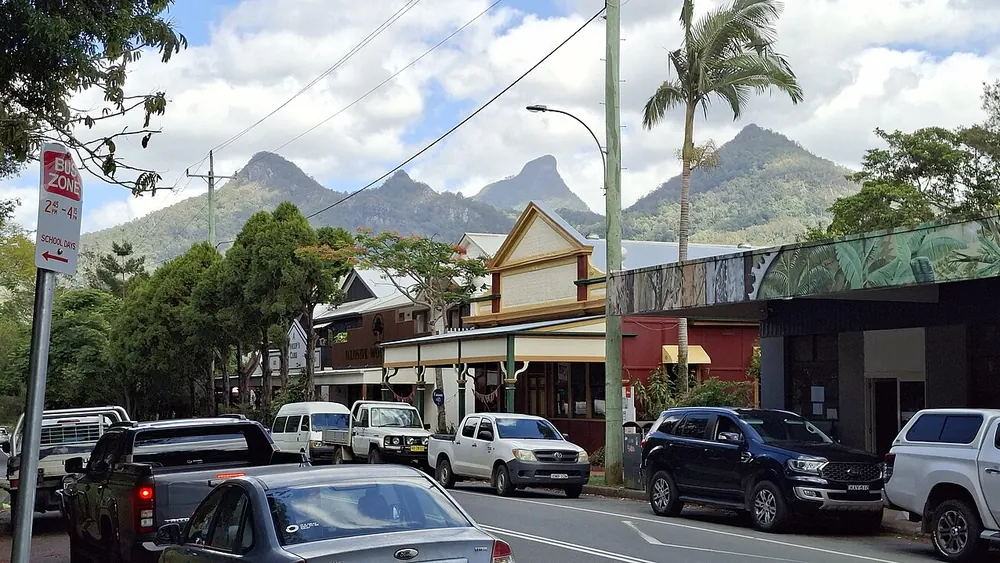 The shopfronts of Uki village with Wollumbin behind them
